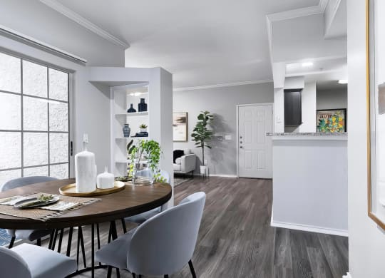 Mesa Verde Rooms Open Floorplan with Dining Area Built in Shelves and Sliding Door to Patio