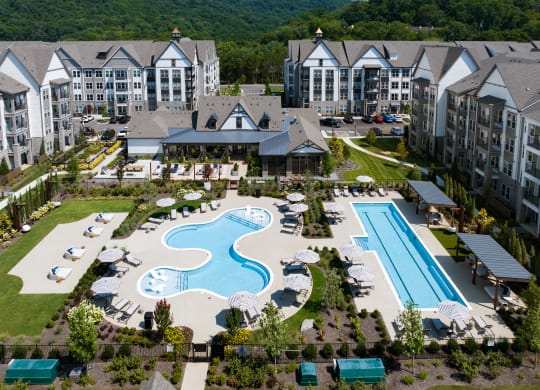 One Resort-Style Pool with In-Pool Chaise Lounges and One Lap Pool