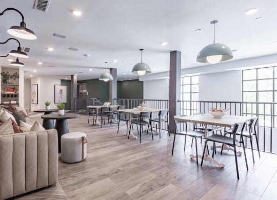 Two-story social area with abundant seating and natural light at Novel Cary