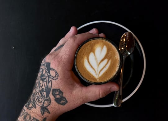 Cozy up with crafted lattes at one of the coffee shops near Novel Cary