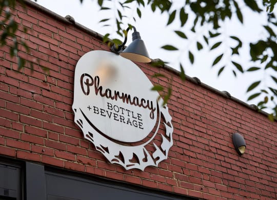Stop by the local Pharmacy Bottle + Beverage for a drink near Novel Cary