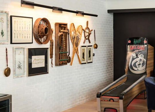 Social game room with pool table, skee ball machine and arcade tables