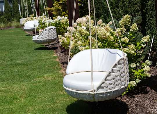 Cozy Hanging Basket Chairs at Harpeth Heights Nestled in Lush Garden Setting