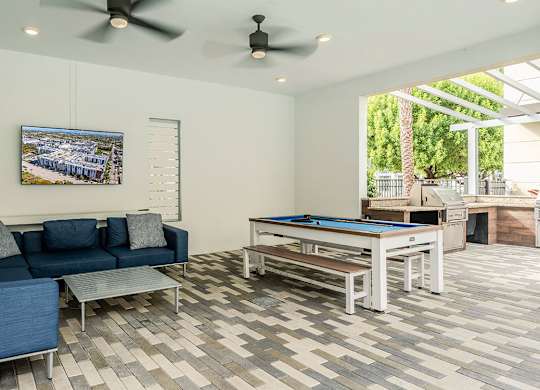 Interior tenant lounge with pool table at Pearl Flagler Village