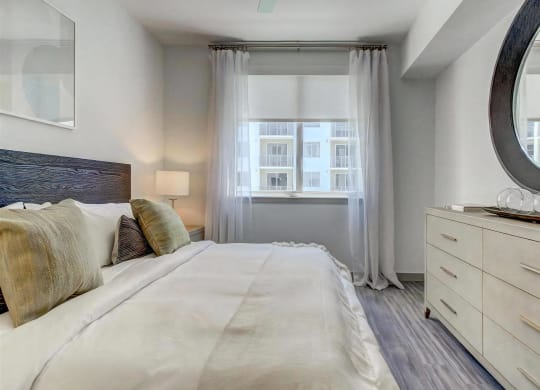 Spacious Bedroom with Wood Style Flooring