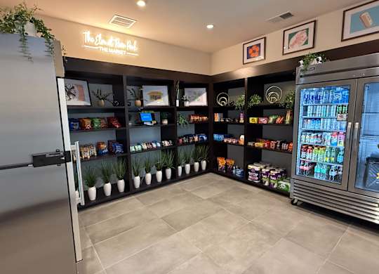 Resident Market With Open Shelving, Drinks, and Packaged Snacks