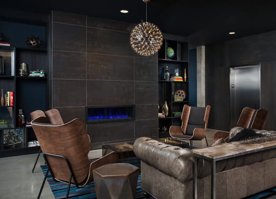 a living room with a couch and chairs and a table
