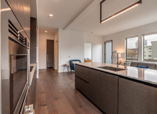 a kitchen with a large counter top and a sink