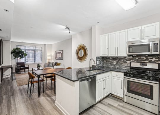 a kitchen with an island and a dining table