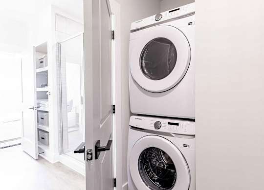 Modern bathroom with convenient in-unit washer and dryer at Novel Cary