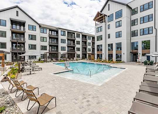 Incredible inground saltwater pool with abundant seating at Novel Cary