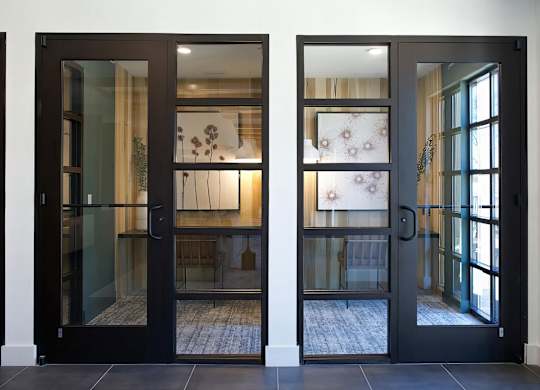 Multiple private office areas with desks and cozy lighting at Novel Cary