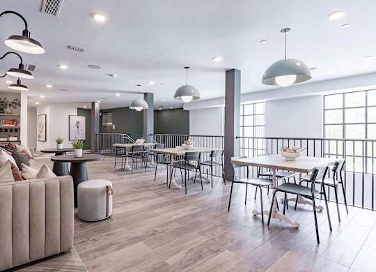 Two-story social area with abundant seating and natural light at Novel Cary