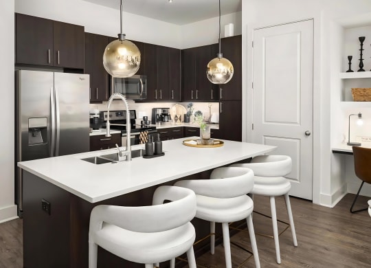 Spacious Kitchen with Quartz Island and Pendant Lighting