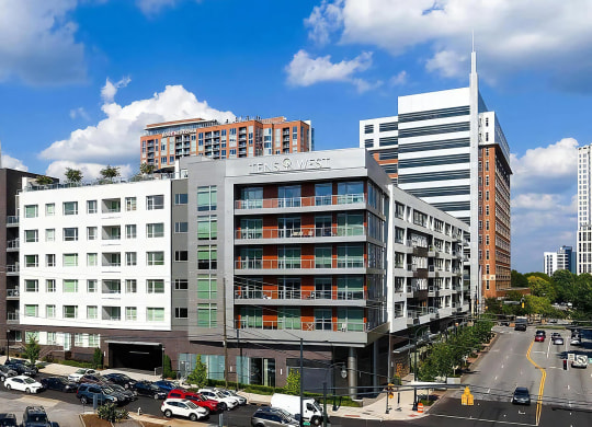 Corner View of Tens on West Apartments With Visible Signage