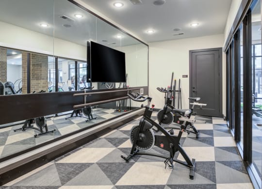 Dedicated Spin and Barre Room With Floor-to-Ceiling Mirrors