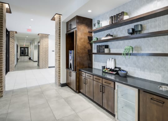 Resident Beverage Station With Open Shelving and Sleek Countertops