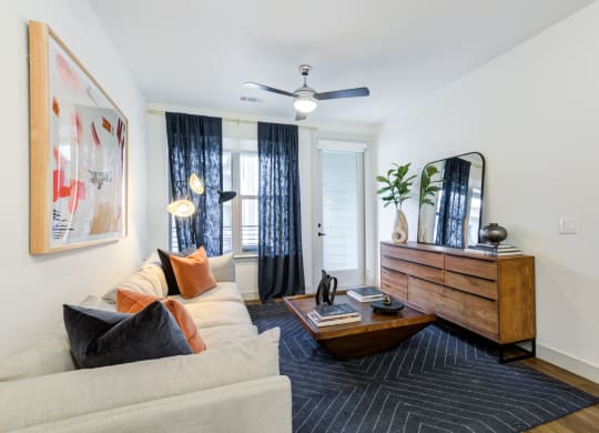 Comfortable Living Room With Wood Coffee Table and Accent Pillows