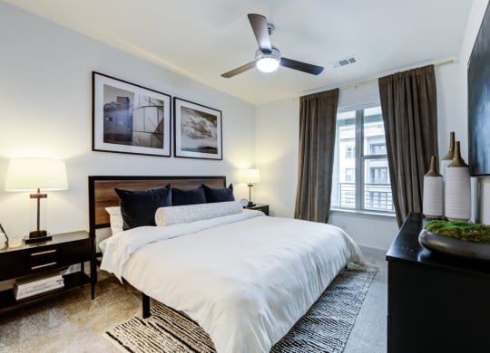 Bedroom With Cozy Carpet, King Bed, and Framed Photography