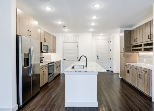 Open-Concept Kitchen With Built-In Wine Storage and Ample Cabinetry