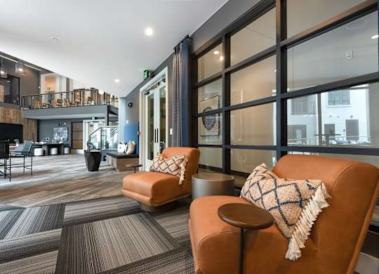 Open-Concept Common Area with Stylish Seating and Lofted Walkways