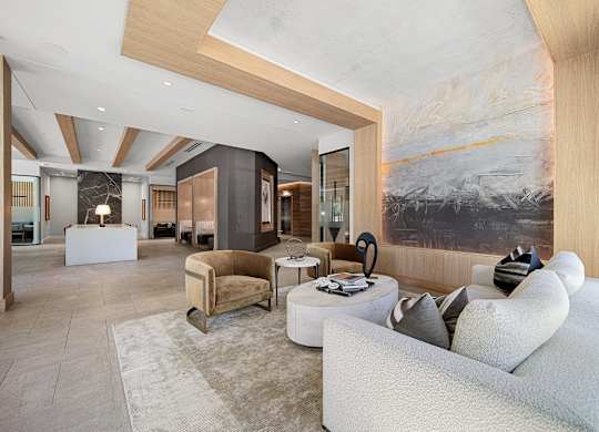 Lobby lounge with curated artwork, plush seating, and refined modern design