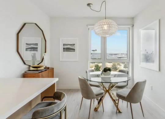 Cozy Dining Nook with Glass Table and Plush Seating