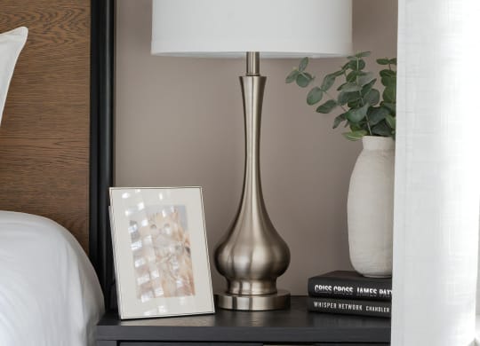 Cozy Bedside Setup with Decorative Accessories and Books