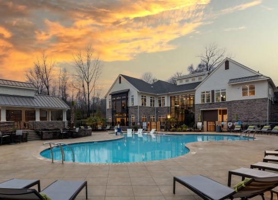 Pool with Clubhouse with Sunset Background