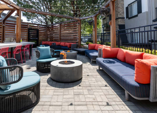 Outdoor Entertainment Area with Colorful Furniture and Grilling Station
