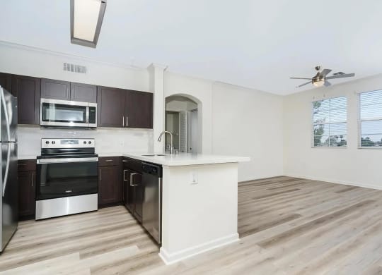 Open Floor Plan with Kitchen Island Overlooking Living Area