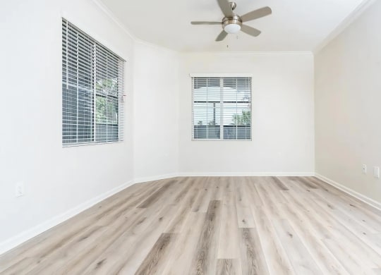 Large Bedroom or Living Space with Ceiling Fan and Natural Light