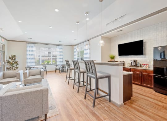 a living room with white walls and hardwood flooring