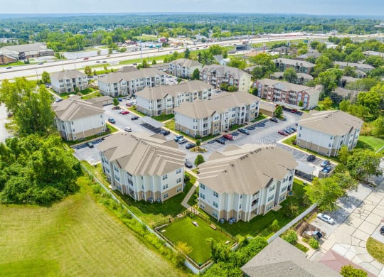 an aerial view of a row of houses in a suburban neighborhood