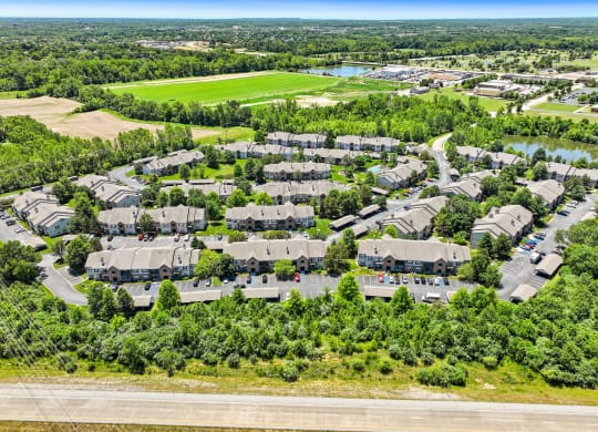 an aerial view of a neighborhood with houses and trees