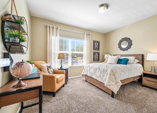 a bedroom with a large bed and a window