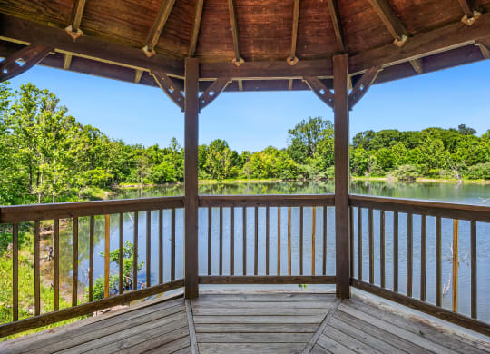 a view of a lake from the porch of a cabin