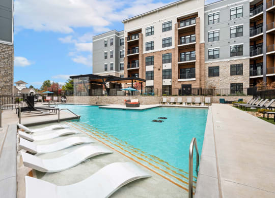 our apartments have a large swimming pool with lounge chairs