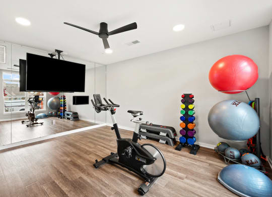 the preserve at ballantyne commons fitness room with exercise equipment and a tv