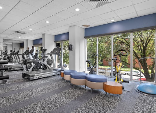 a fitness center with treadmills and other exercise equipment