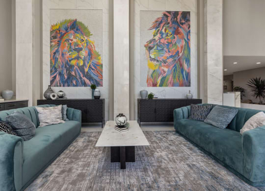a living room filled with furniture and a large painting of a lion