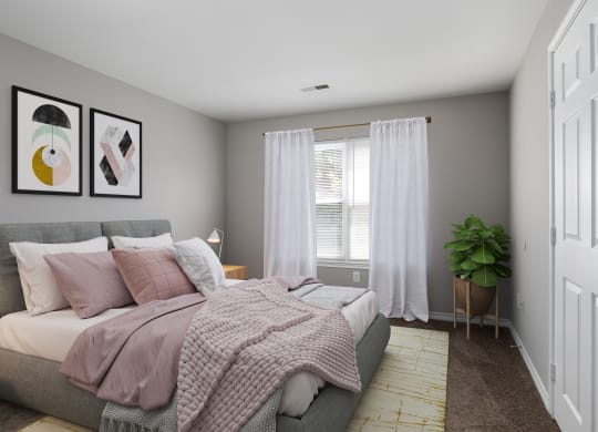 a bedroom with a bed and a plant and white curtains