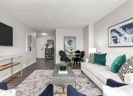 a living room with grey walls and a white couch