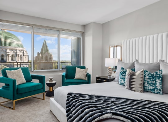 a bedroom with a large bed and a window