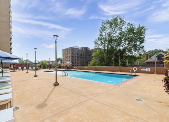 this is a photo of the pool area at harvard square apartments in dallas, tx