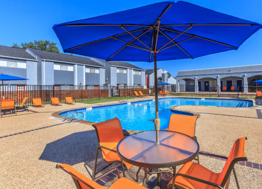 our apartments have a pool and table with umbrellas