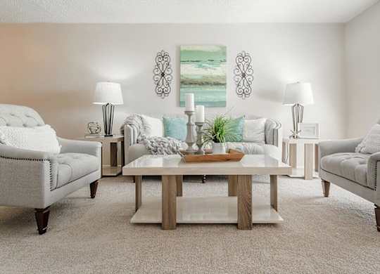 a living room with two couches and a table