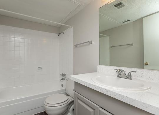 a bathroom with a sink toilet and a bath tub