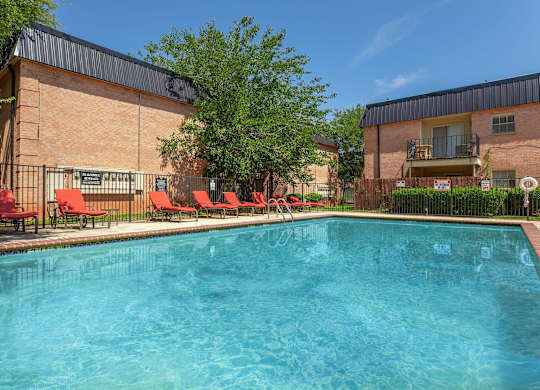 our apartments have a large pool and lounge chairs