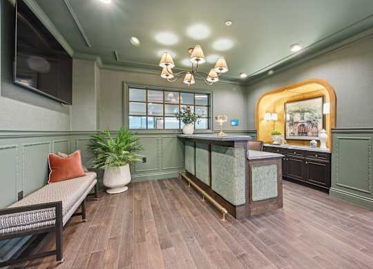A room with a wooden floor and a green wall.